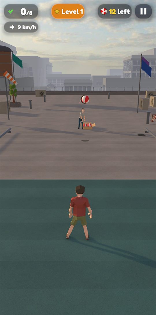 A ball in the wind over a city rooftop, flags blowing