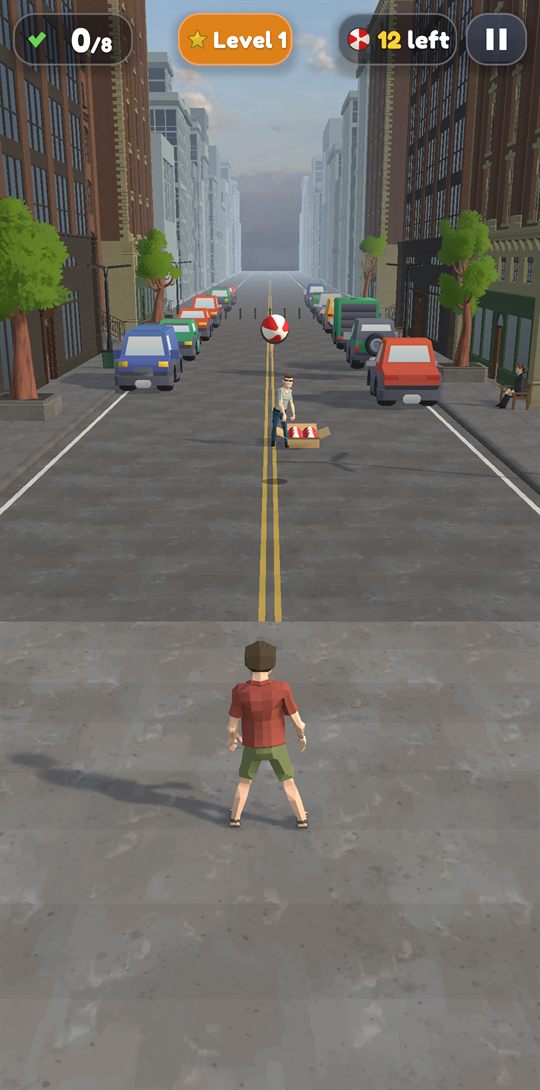 A ball in flight in a town street closed to traffic